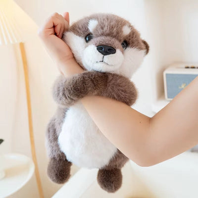 doudou loutre accrochant