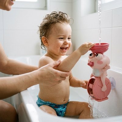 Jouet de bain bébé grenouille rose