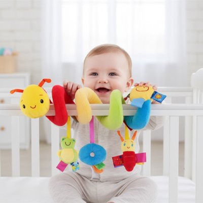 Jouet eveil bebe spirale accroché au lit